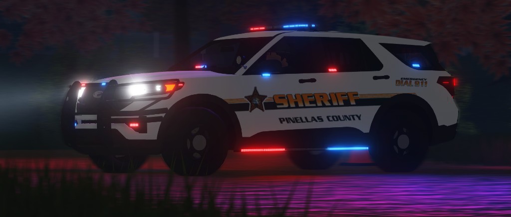 Pinellas County Sheriff unit with emergency lights at night